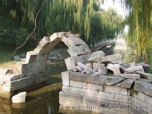 The pavilion and the stone arch are among few of the only remaining buildings in the ruins of the Old Summer Palace.