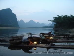 Farmers are having a rest on their bamboo raft.