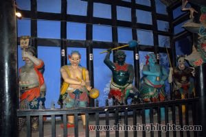 Lifelike,colourful statues of figures in temple