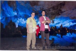 A father and his son at the Reed Flute Cave