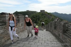 China Highlights guests are climbing the Great wall.